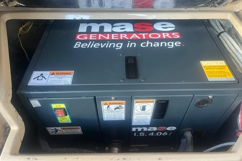 Slide: The Image of Mase generator in a 2013 Cutwater C-28 boat, featuring safety warnings and controls. - 23
