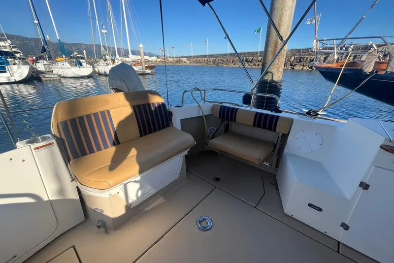 Slide: The Image of 2013 Cutwater C-28 boat interior with seating, docked in a marina. - 26