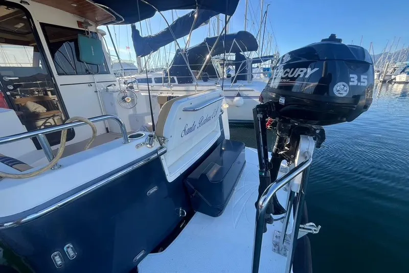 Slide: The Image of 2013 Cutwater C-28 boat with Mercury 3.5 outboard motor docked at marina. - 29