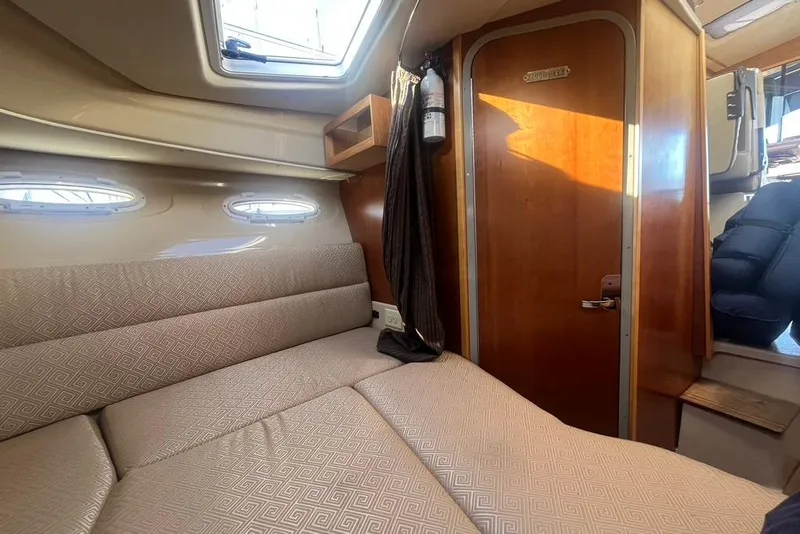 Slide: The Image of Interior of 2013 Cutwater C-28 boat with cozy seating and wooden accents. - 36