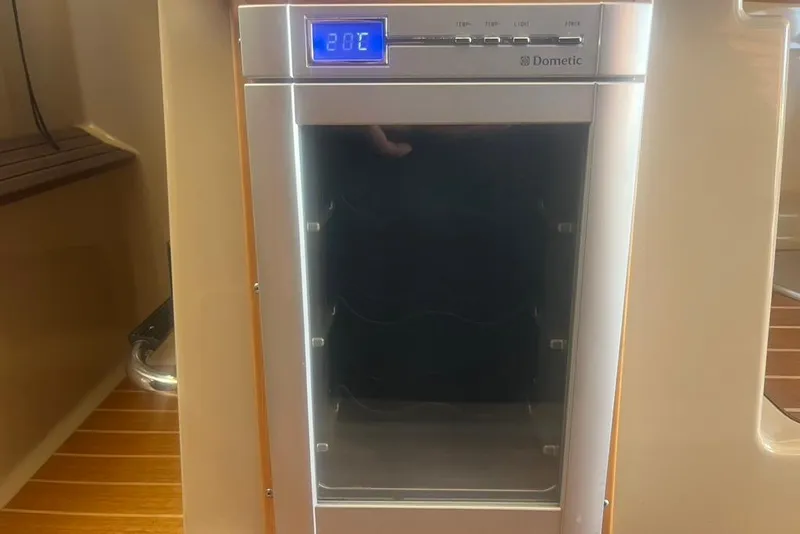 Slide: The Image of Dometic fridge inside a 2013 Cutwater C-28 boat, displaying 20°C temperature. - 45