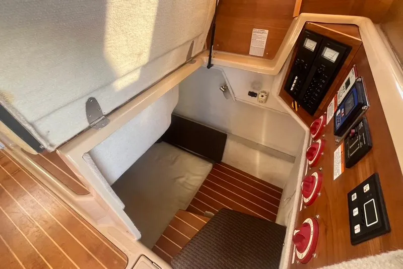 Slide: The Image of 2013 Cutwater C-28 interior with control panels and seating area. - 7