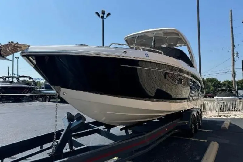 Slide: The Image of 2018 Chaparral 307 SSX boat on trailer in outdoor setting. - 16