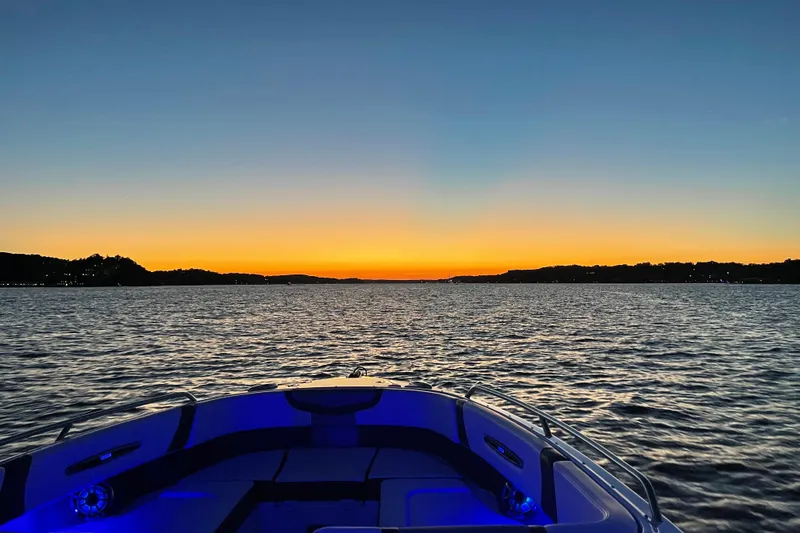 Slide: The Image of Chaparral 307 SSX boat at sunset on a serene lake, 2018 model. - 3