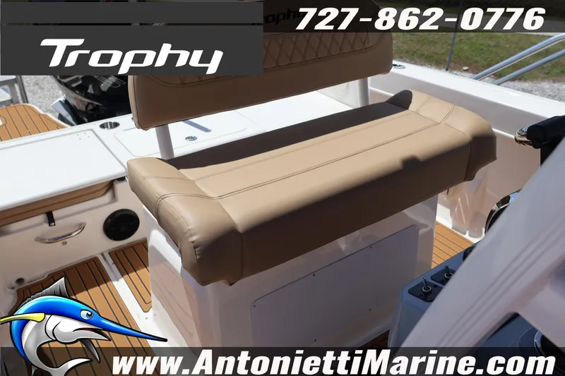 Slide: The Image of 2026 Bayliner Trophy T22CC boat interior with tan seating, featuring Antonietti Marine branding. - 10
