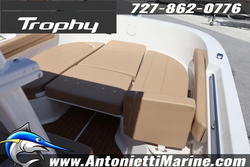 Slide: The Image of 2026 Bayliner Trophy T22CC boat interior with tan seating, showcased by Antonietti Marine. - 11