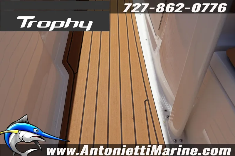 Slide: The Image of 2026 Bayliner Trophy T22CC boat deck with teak flooring, Antonietti Marine branding. - 14