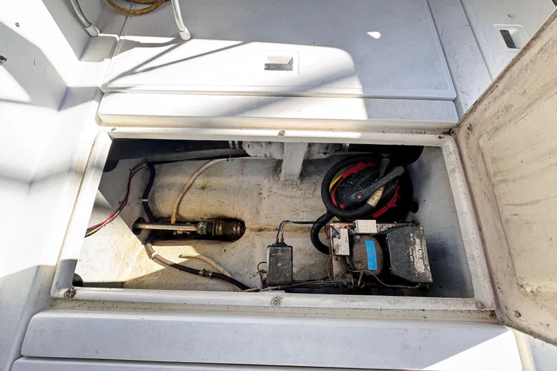 Slide: The Image of Engine compartment of 1987 Luhrs Alura 30 boat, showing wiring and equipment. - 18