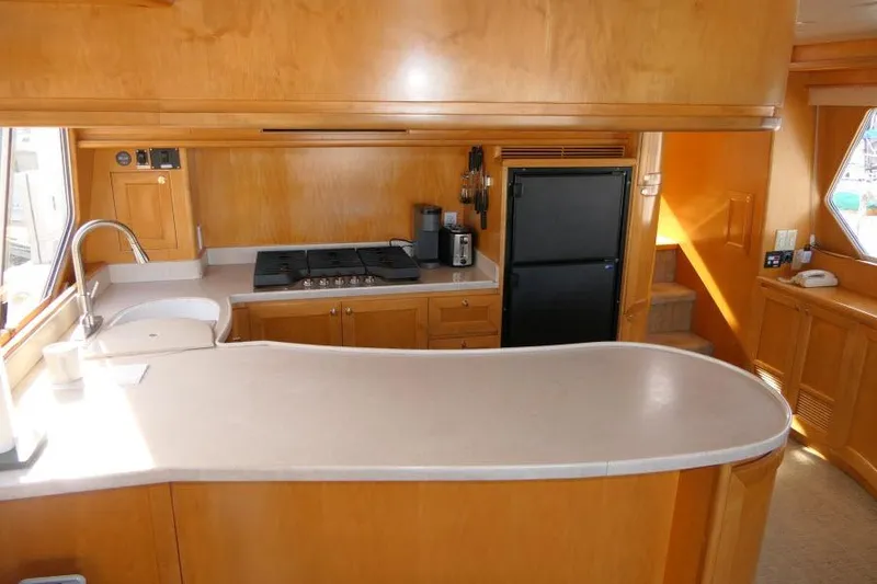 Slide: The Image of Luxurious kitchen interior of 1999 Hampton 490 Pilothouse yacht with modern appliances. - 15