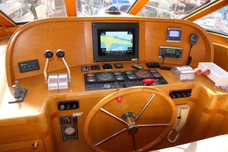 Slide: The Image of Pilothouse of 1999 Hampton 490 with navigation instruments and steering wheel. - 19