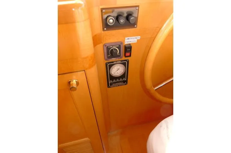 Slide: The Image of Control panel of a 1999 Hampton 490 Pilothouse yacht with gauges and switches. - 20