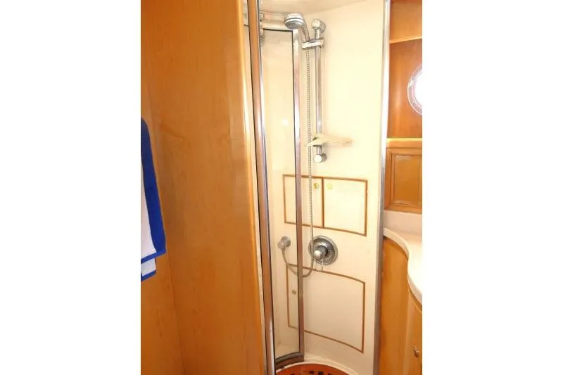 Slide: The Image of Shower area in 1999 Hampton 490 Pilothouse yacht with wooden accents. - 42