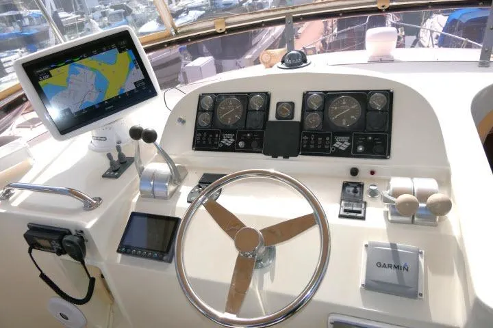Slide: The Image of Cockpit of 1999 Hampton 490 Pilothouse with navigation equipment and steering wheel. - 50
