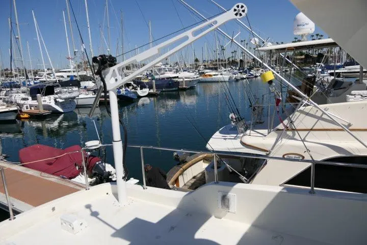 Slide: The Image of Marina view with 1999 Hampton 490 Pilothouse yacht docked among sailboats. - 66