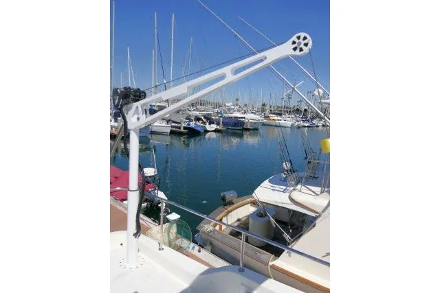 Slide: The Image of Hampton 490 Pilothouse 1999 yacht with davit crane in marina setting. - 67