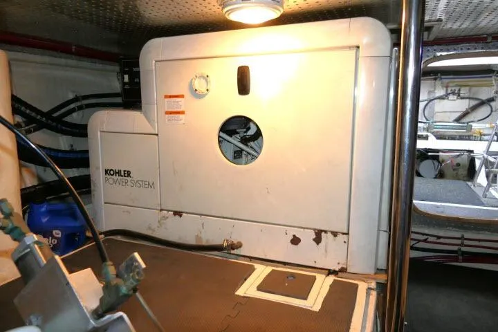 Slide: The Image of Engine room of 1999 Hampton 490 Pilothouse with Kohler power system. - 81