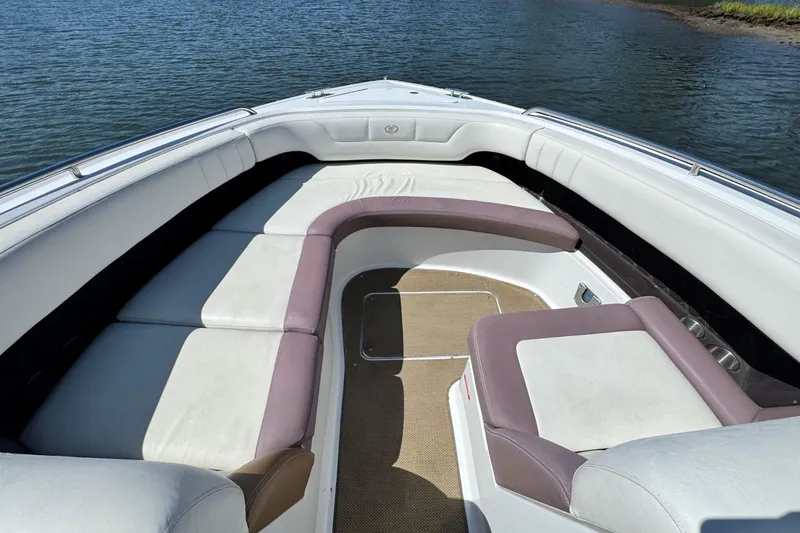 Slide: The Image of Luxurious seating on a 2012 Cobalt 296 boat, overlooking calm waters. - 29