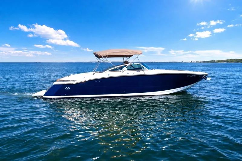 Slide: The Image of 2012 Cobalt 296 boat cruising on a sunny day in open water. - 5