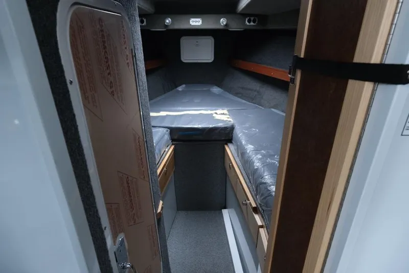 Slide: The Image of Interior cabin of 2026 Hewescraft 290 Adventure ET Hardtop, featuring a cozy sleeping area. - 15
