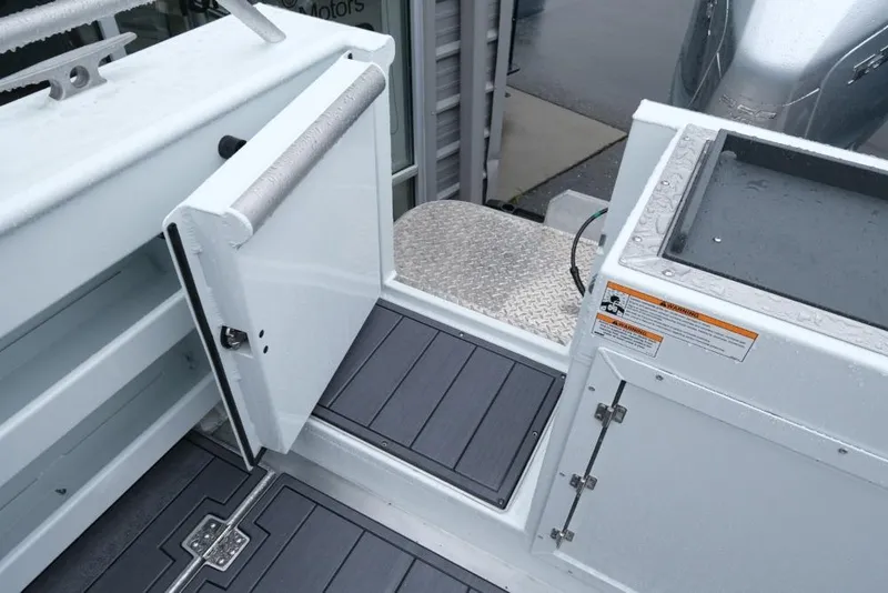 Slide: The Image of 2026 Hewescraft 290 Adventure ET Hardtop boat deck with open hatch and safety warning. - 19