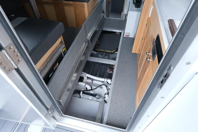 Slide: The Image of Interior view of 2026 Hewescraft 290 Adventure ET Hardtop, showcasing storage and utility compartments. - 22