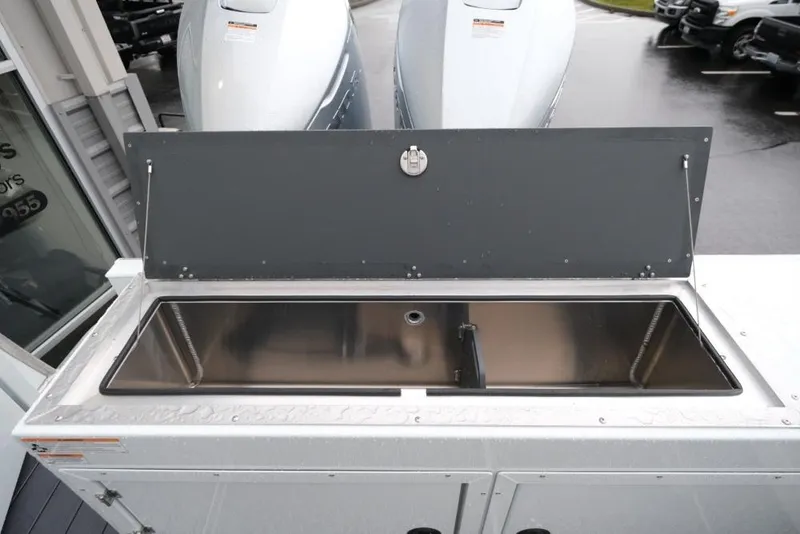 Slide: The Image of 2026 Hewescraft 290 Adventure ET Hardtop boat with open storage compartment. - 23