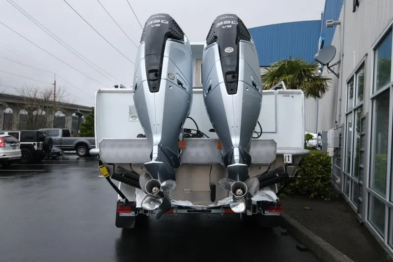 Slide: The Image of 2026 Hewescraft 290 Adventure ET Hardtop with twin 350 V8 engines, parked outdoors. - 5