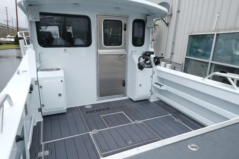 Slide: The Image of 2026 Hewescraft 290 Adventure ET Hardtop boat deck with sleek design and modern features. - 7