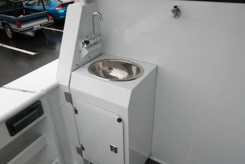 Slide: The Image of 2026 Hewescraft 290 Adventure ET Hardtop boat sink and faucet detail. - 9