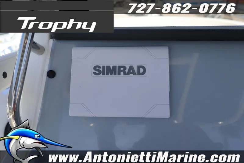 Slide: The Image of 2026 Bayliner Trophy T20CC dashboard with Simrad display, contact info, and logo. - 10