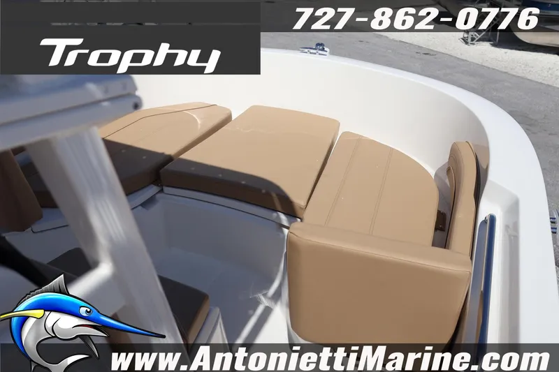 Slide: The Image of 2026 Bayliner Trophy T20CC boat interior with tan seating, displayed at Antonietti Marine. - 11