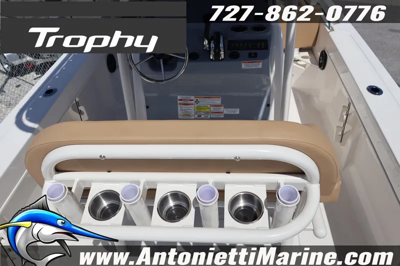 Slide: The Image of 2026 Bayliner Trophy T20CC boat interior with rod holders and steering console. - 6