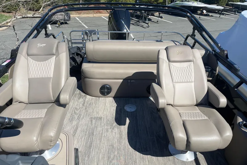 Slide: The Image of 2024 Ranger 2500LS boat interior with beige seating and modern design. - 11
