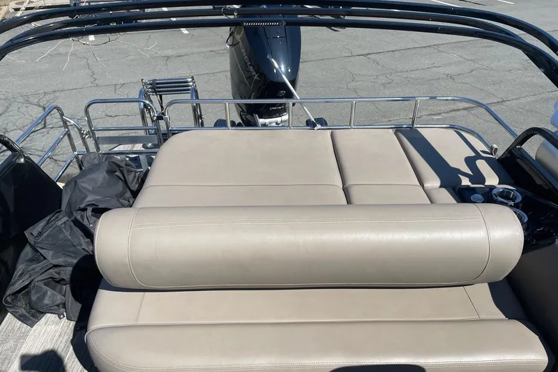 Slide: The Image of 2024 Ranger 2500LS boat with beige leather seating and stainless steel railings. - 12
