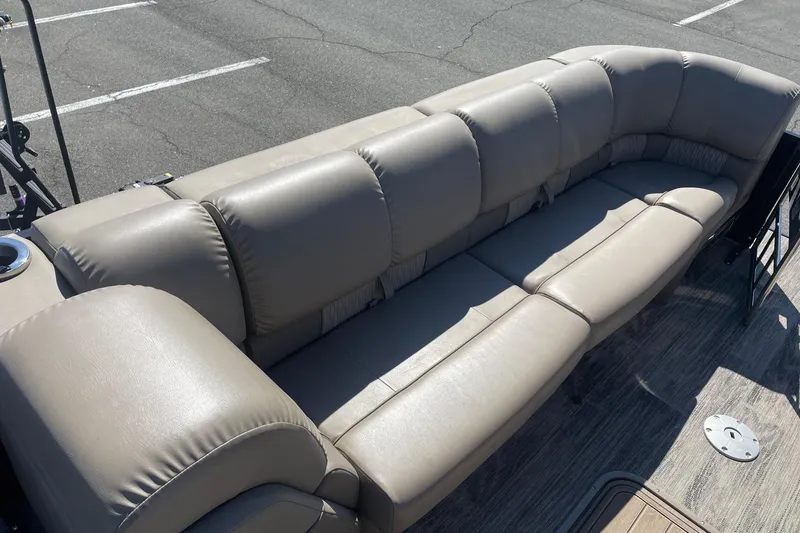 Slide: The Image of Luxurious seating on 2024 Ranger 2500LS boat, featuring plush beige upholstery. - 15