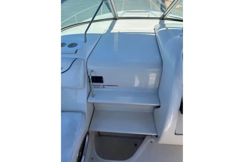 Slide: The Image of 2004 Sea Ray 240 Sundancer boat interior with steps and railing. - 10