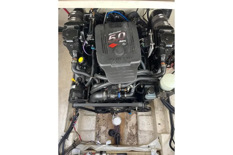 Slide: The Image of Engine of 2004 Sea Ray 240 Sundancer boat, featuring MerCruiser 5.0 MPI. - 28