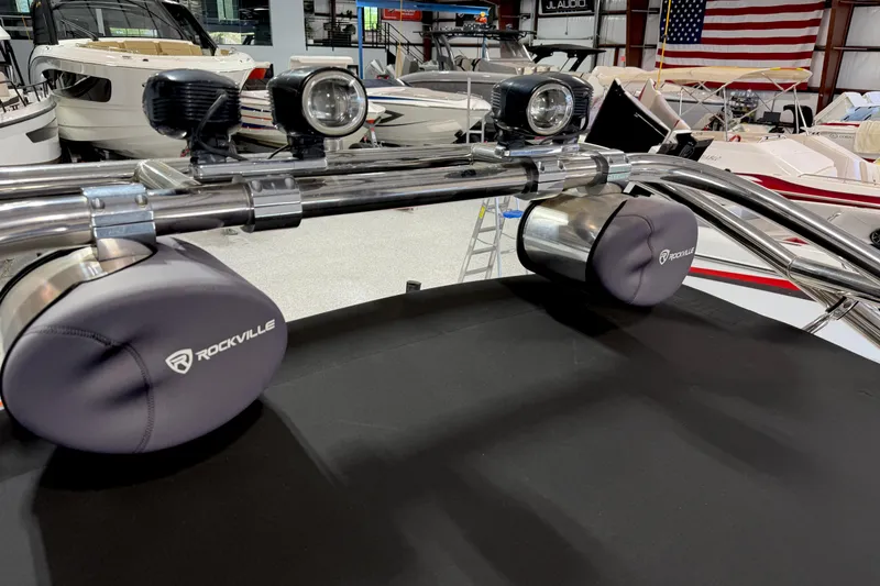 Slide: The Image of 2005 Calabria PRO V boat with Rockville speakers and lights in a showroom. - 15