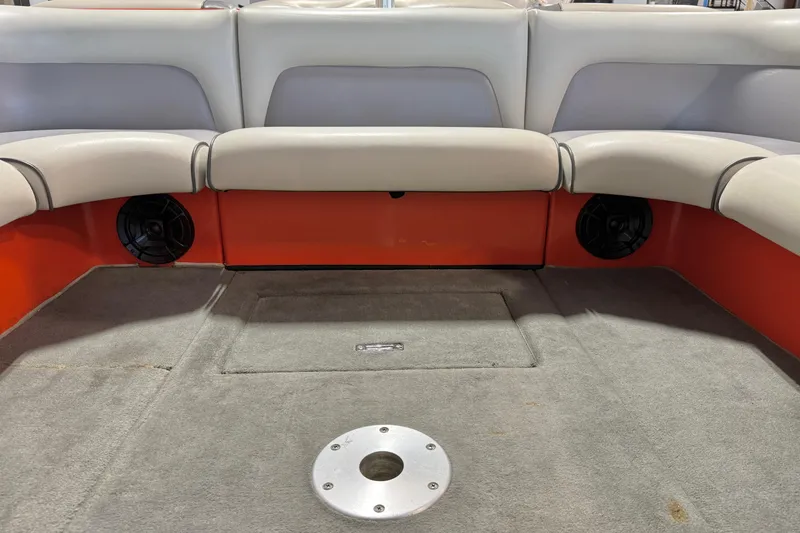 Slide: The Image of 2005 Calabria PRO V boat interior with gray seating and orange accents. - 17