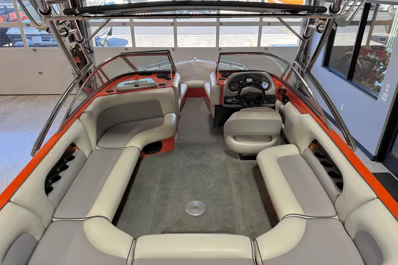 Slide: The Image of 2005 Calabria PRO V boat interior with gray seating and orange accents. - 23