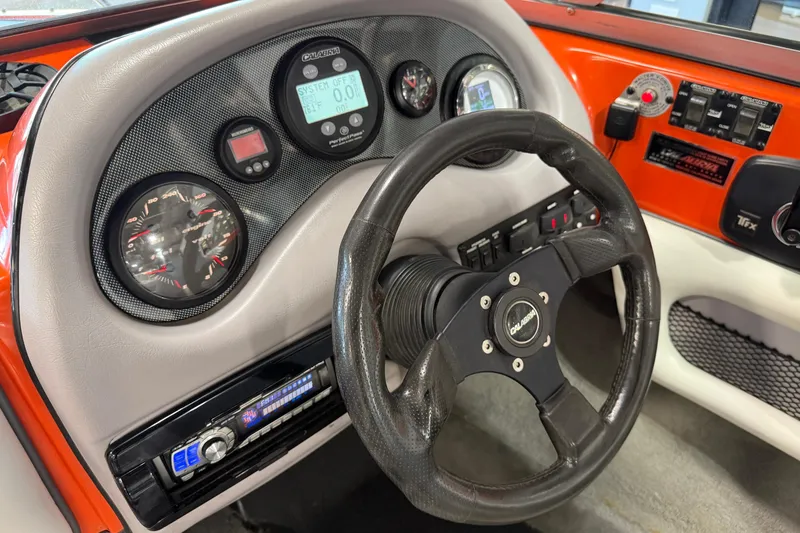 Slide: The Image of Dashboard of a 2005 Calabria PRO V boat with steering wheel and gauges. - 26