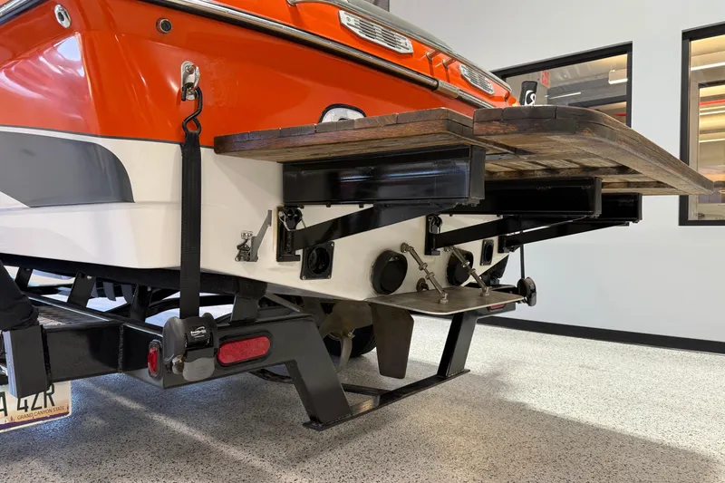 Slide: The Image of Rear view of a 2005 Calabria PRO V boat with wooden swim platform. - 7