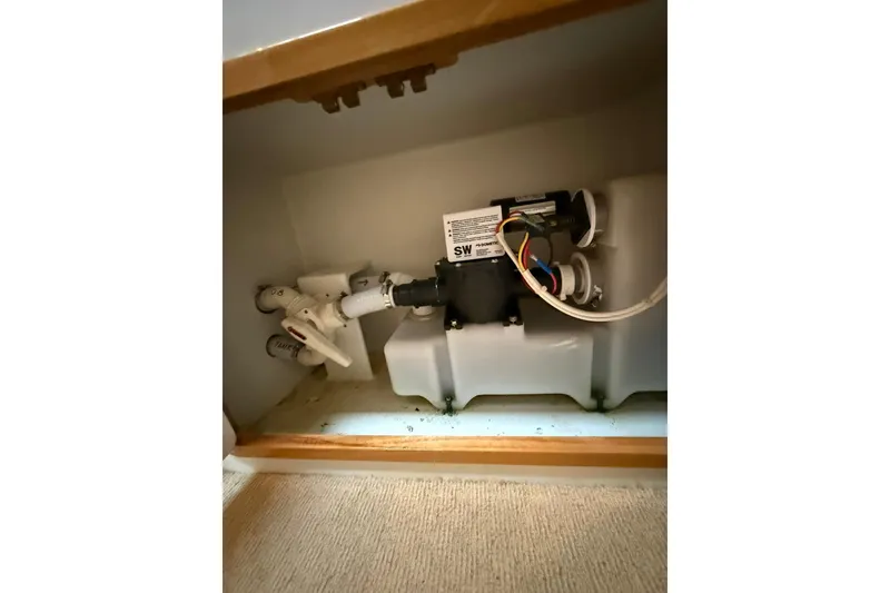 Slide: The Image of Plumbing system inside 2002 Norris Custom Motor Catamaran 41.4, featuring pipes and wiring. - 112