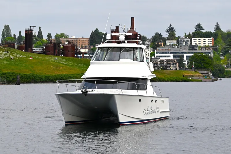 Slide: The Image of 2002 Roger Hill Power Cat 41.4 cruising on a scenic waterway. - 12