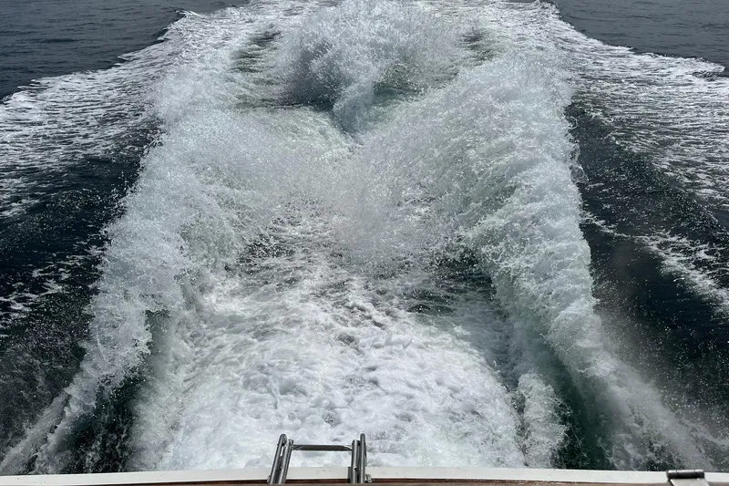 Slide: The Image of Wake of a 2002 Norris Custom Motor Catamaran 41.4 cruising through open water. - 120