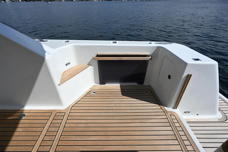 Slide: The Image of Sleek deck of 2002 Roger Hill Power Cat 41.4 with wooden flooring, overlooking water. - 22
