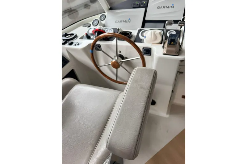 Slide: The Image of Helm of 2002 Norris Custom Motor Catamaran 41.4 with Garmin navigation system. - 28