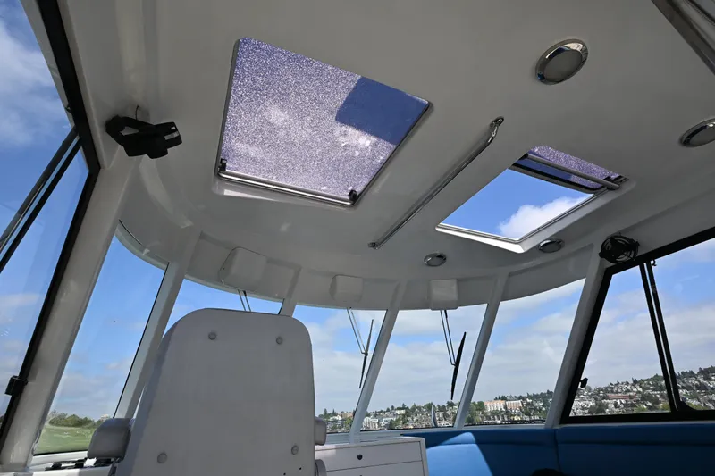 Slide: The Image of Interior view of 2002 Roger Hill Power Cat 41.4 with skylights and panoramic windows. - 29