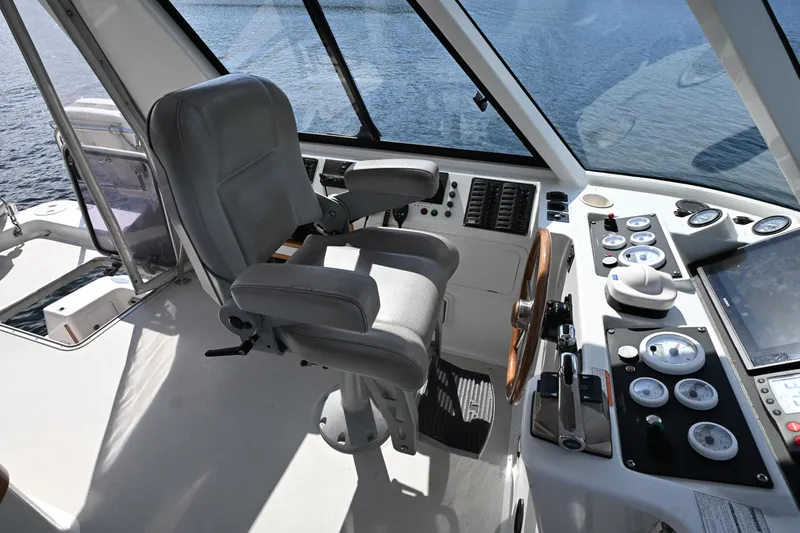 Slide: The Image of Captain's chair and control panel on 2002 Roger Hill Power Cat 41.4 boat. - 31