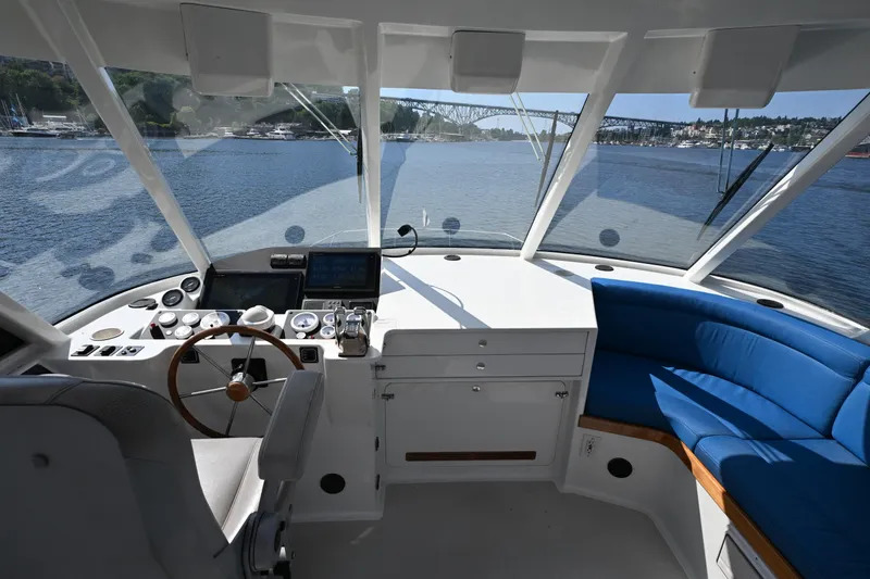 Slide: The Image of Interior view of 2002 Roger Hill Power Cat 41.4, featuring helm and blue seating. - 35